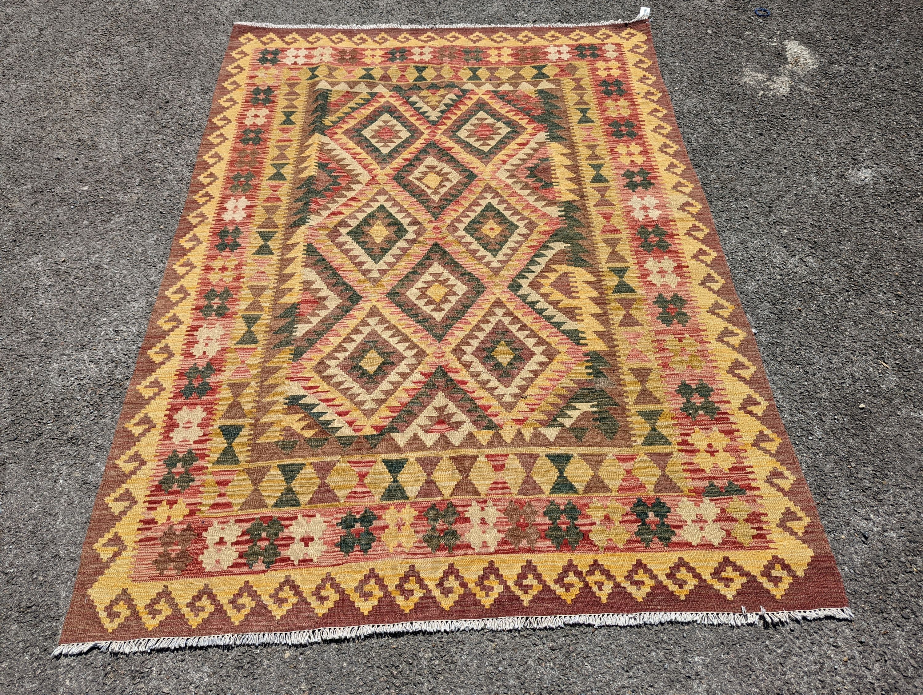 An Anatolian design polychrome geometric flatweave Kilim rug, 215 x 157cm